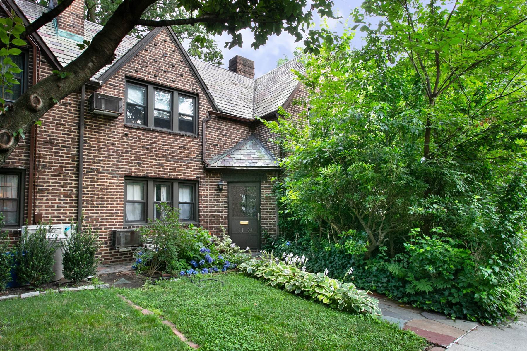 Single Family Homes at 'ENGLISH TUDOR TOWNHOUSE W/ GARAGE' 111-04 75th Avenue Forest Hills, New York 11375 United States